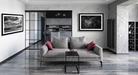 Framed Isle Of Skye Print by Michael Hart - Storm Clouds Kyleakin displayed in a modern grey living room. A bold monochrome landscape adds depth to interior decor.