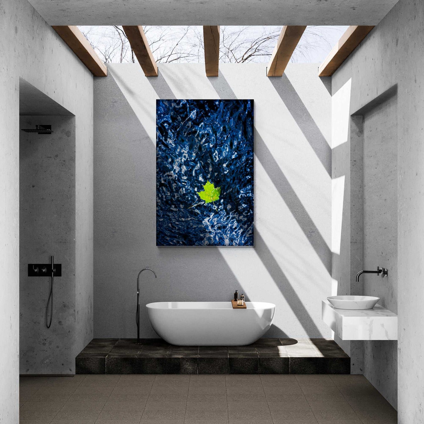 Adrift – Blue Water and Leaf Color Photograph from Maine displayed above a bathtub in a minimalist bathroom, adding calm and natural elegance to the decor.