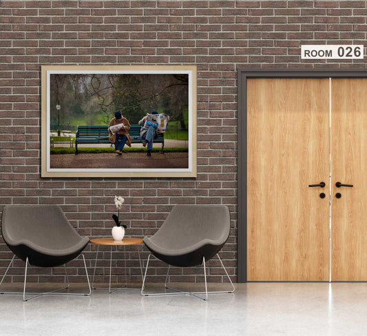 The Saturday News – A Photograph of Couple Captured in Hyde Park displayed in a modern hallway with brick walls. Ideal fine art photography for interior designers and UK travel photography lovers.