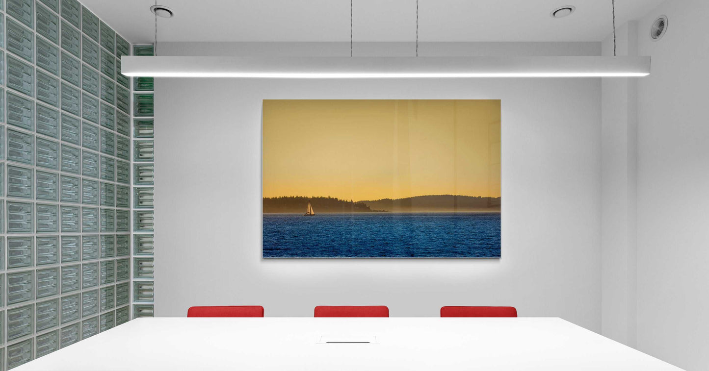 Golden Hour Sailboat photograph mounted in a minimalist conference room, adding coastal elegance with golden hour maritime scenery.