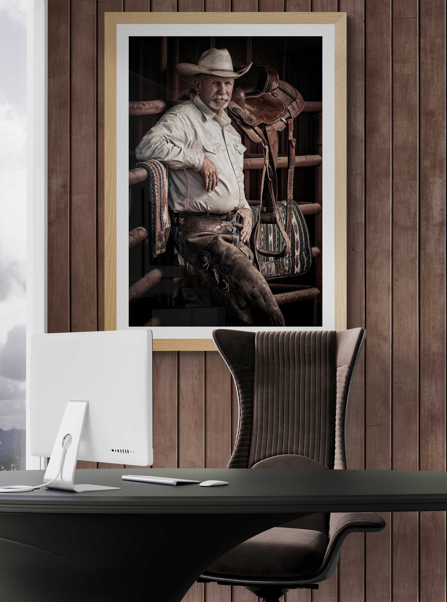 The Foreman-A Portrait of A Texas Cowboy displayed in a wood-paneled office, offering rustic charm and fine art western photography for professional interiors.