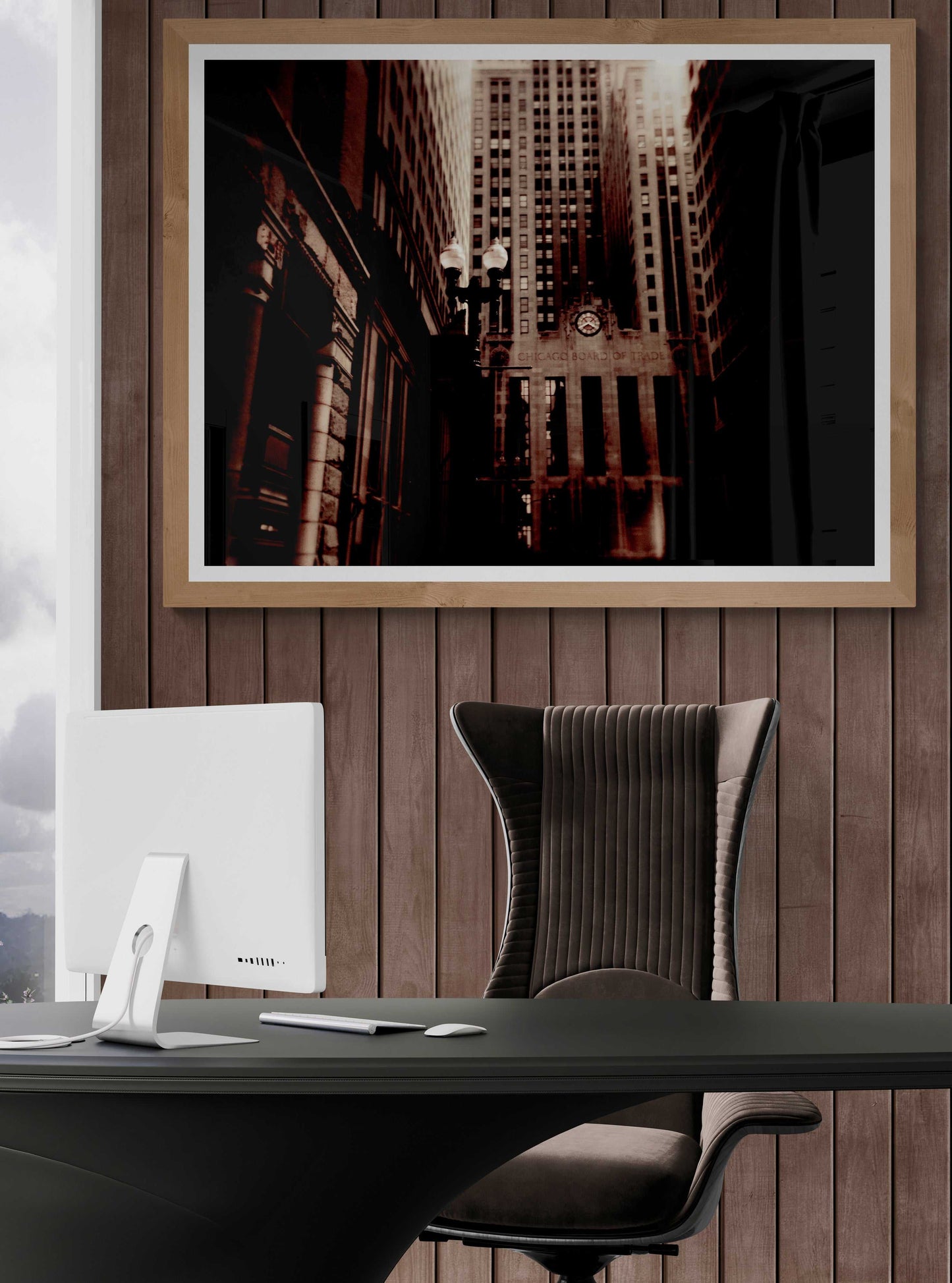 Framed sepia-toned Chicago Board of Trade photo in a wood-paneled office, enhancing the Art Deco ambiance with vintage architecture.