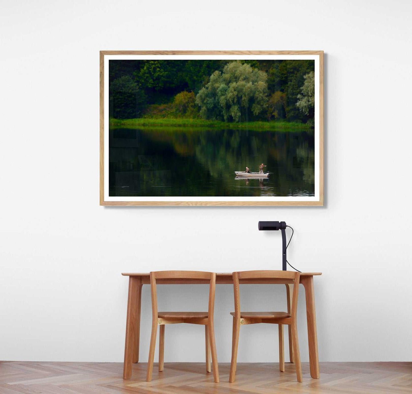 Fishermen on Linlithgow Loch – A Scene of Light, Gesture, and Color fine art print featuring two fishermen in a boat on calm waters near lush greenery. Ideal for home or office decor, this tranquil Scottish landscape adds depth and serenity to interior design.