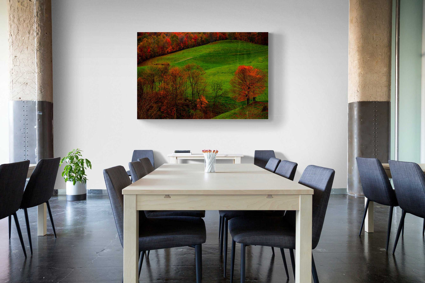 A framed print of West Virginia Autumn hanging on the wall in a room setting