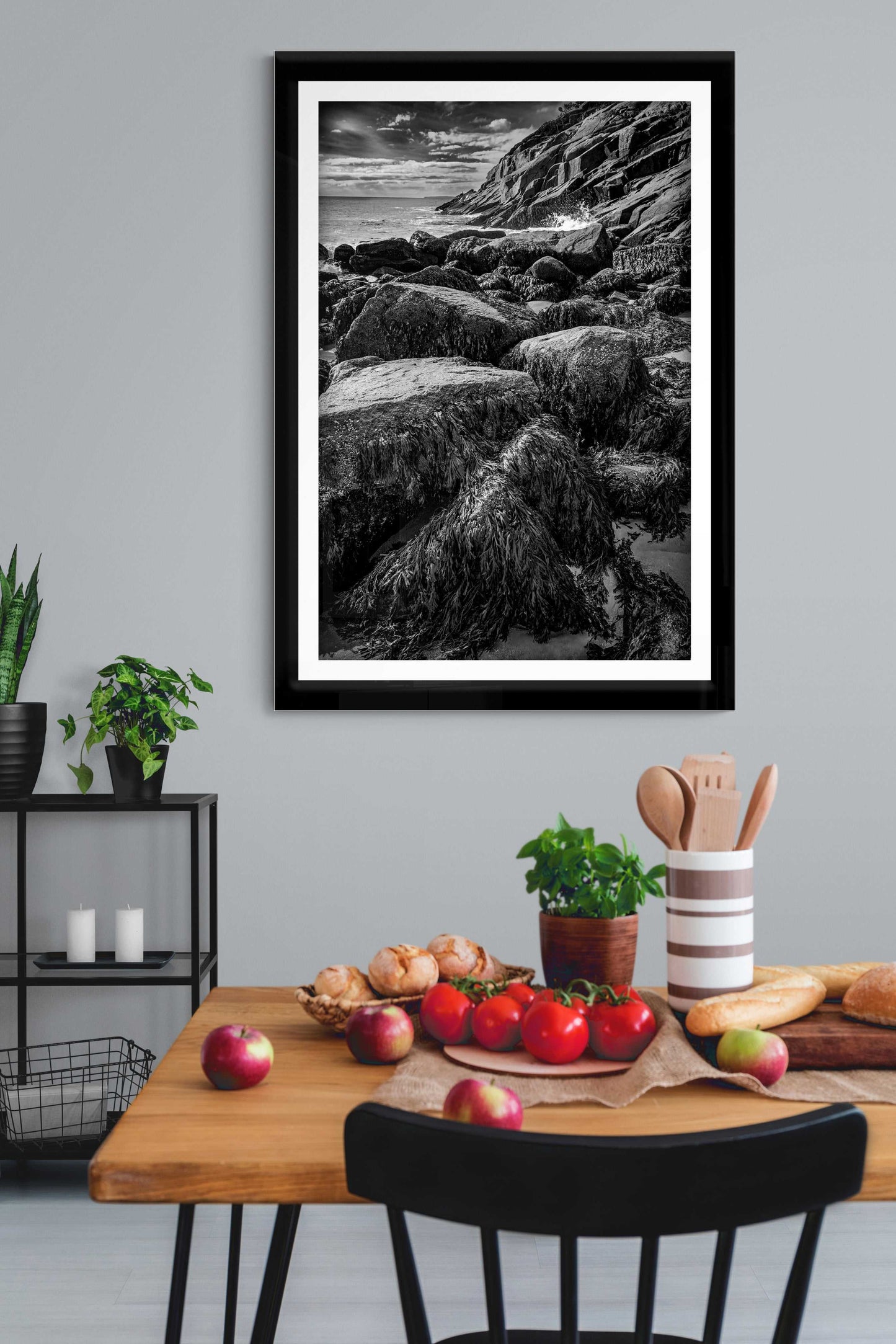 After Doré – Moody Black and White Coastal Photography framed and displayed in a modern dining room, enhancing interior decor with fine art seascape.