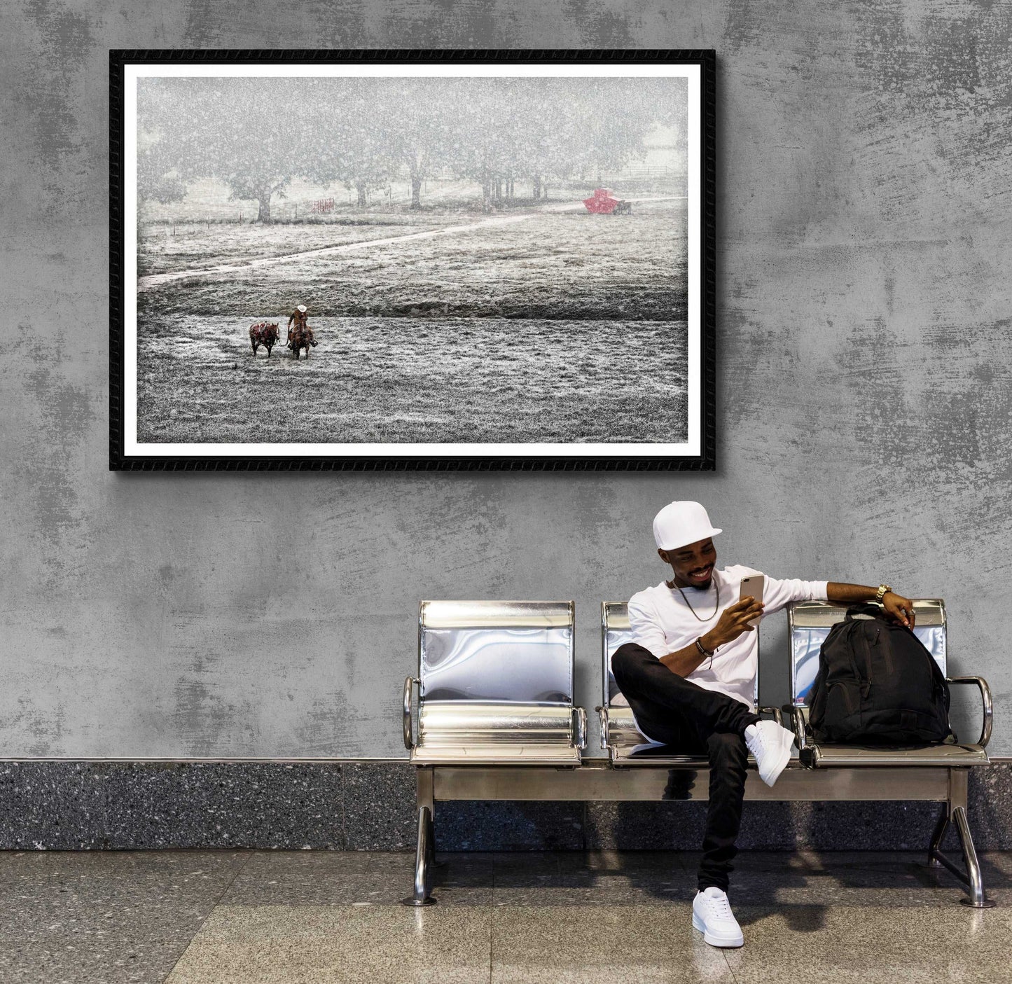 Large framed Home for Christmas – The Cowboy and The Horse artwork in a public space, adding Western fine art flair to a modern waiting area.