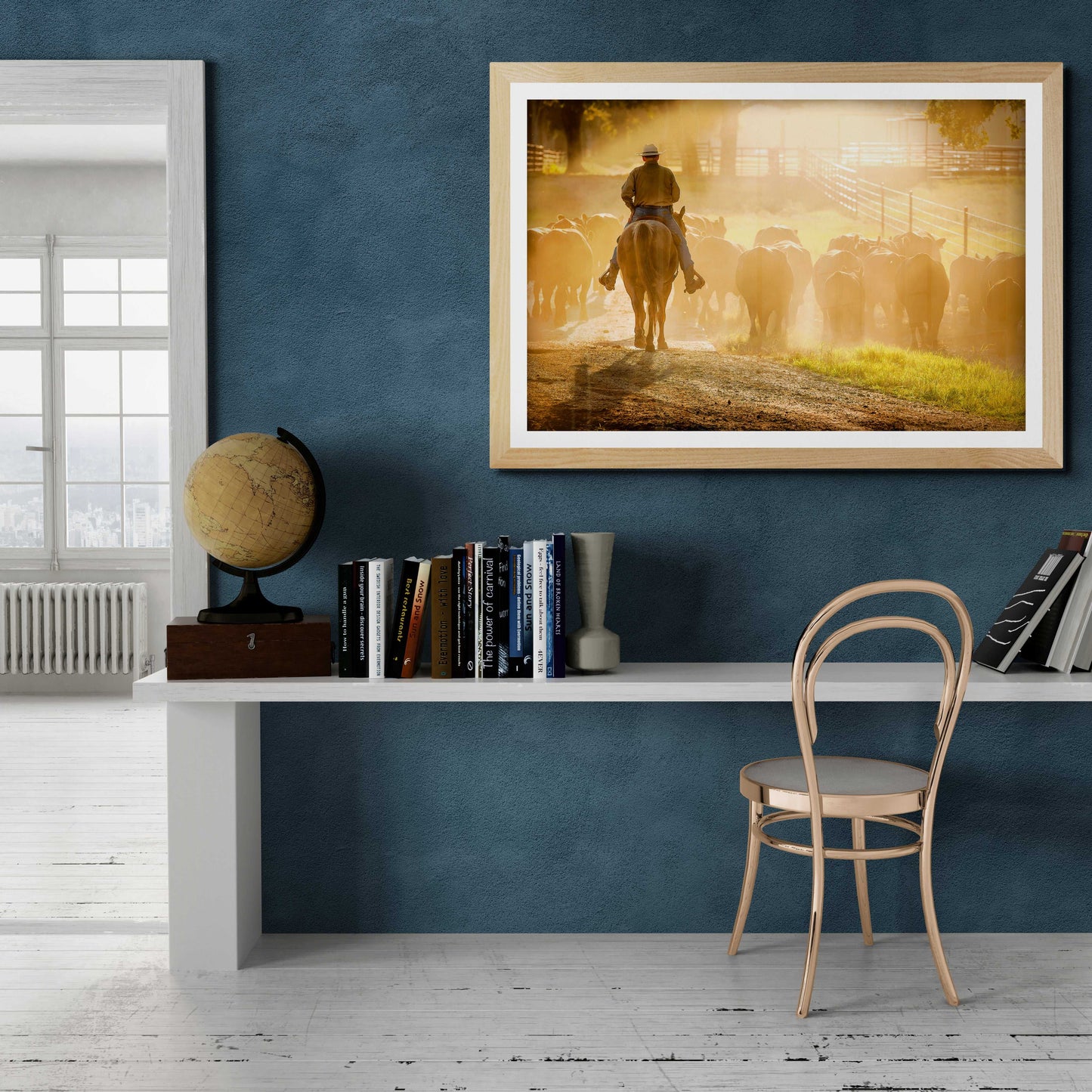 Golden Hour Roundup – Texas Cowboy and Cattle at 44 Farms framed wall art displayed in a modern home office. Western decor for stylish interiors.