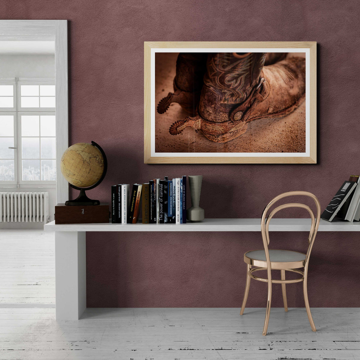 Michael Hart’s 'Well Worn – A Real Texan’s Cowboy Boots' Western fine art print framed above a home office desk, blending cowboy culture with modern interior design.