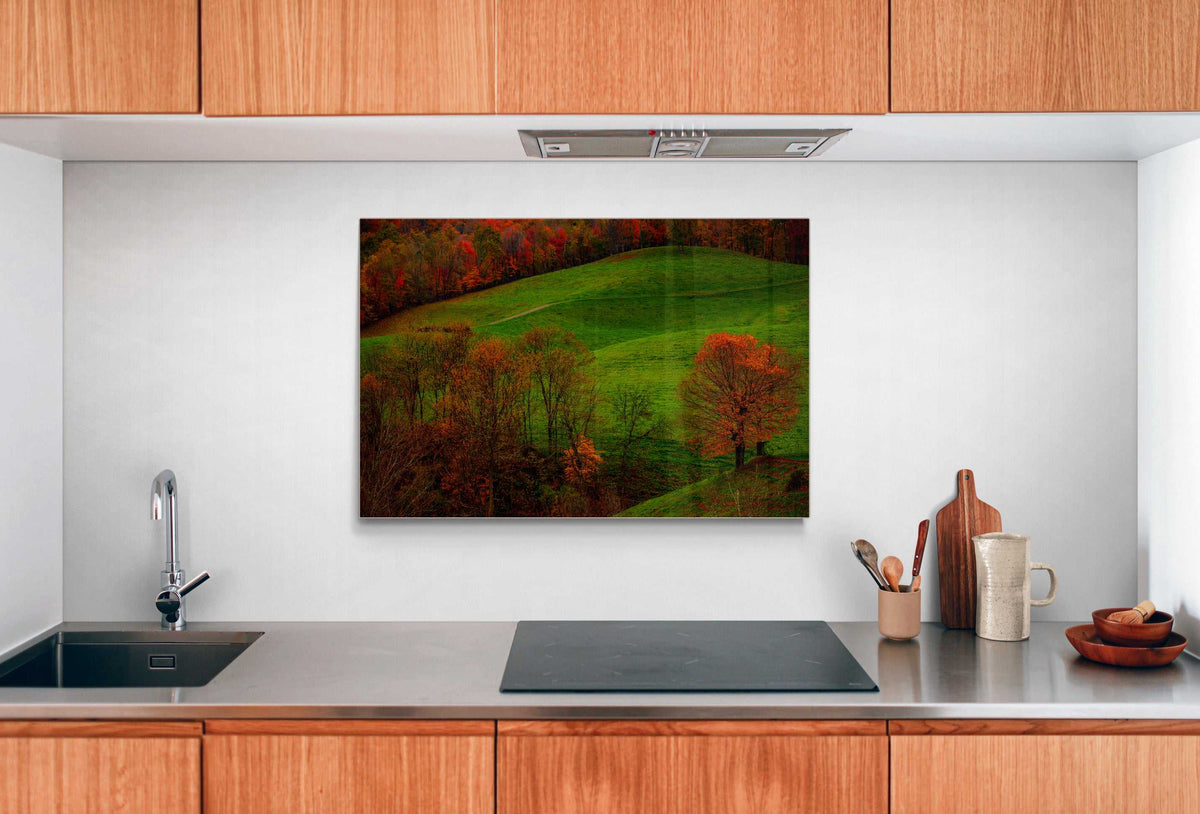 A framed print of West Virginia Autumn hanging on the wall in a room setting