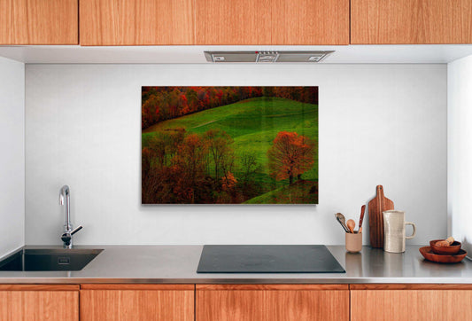 A framed print of West Virginia Autumn hanging on the wall in a room setting