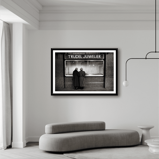 Zurich Series #7 – Window Shopping on Bahnhofstrasse framed black and white print displayed in a modern living room with minimalist decor.