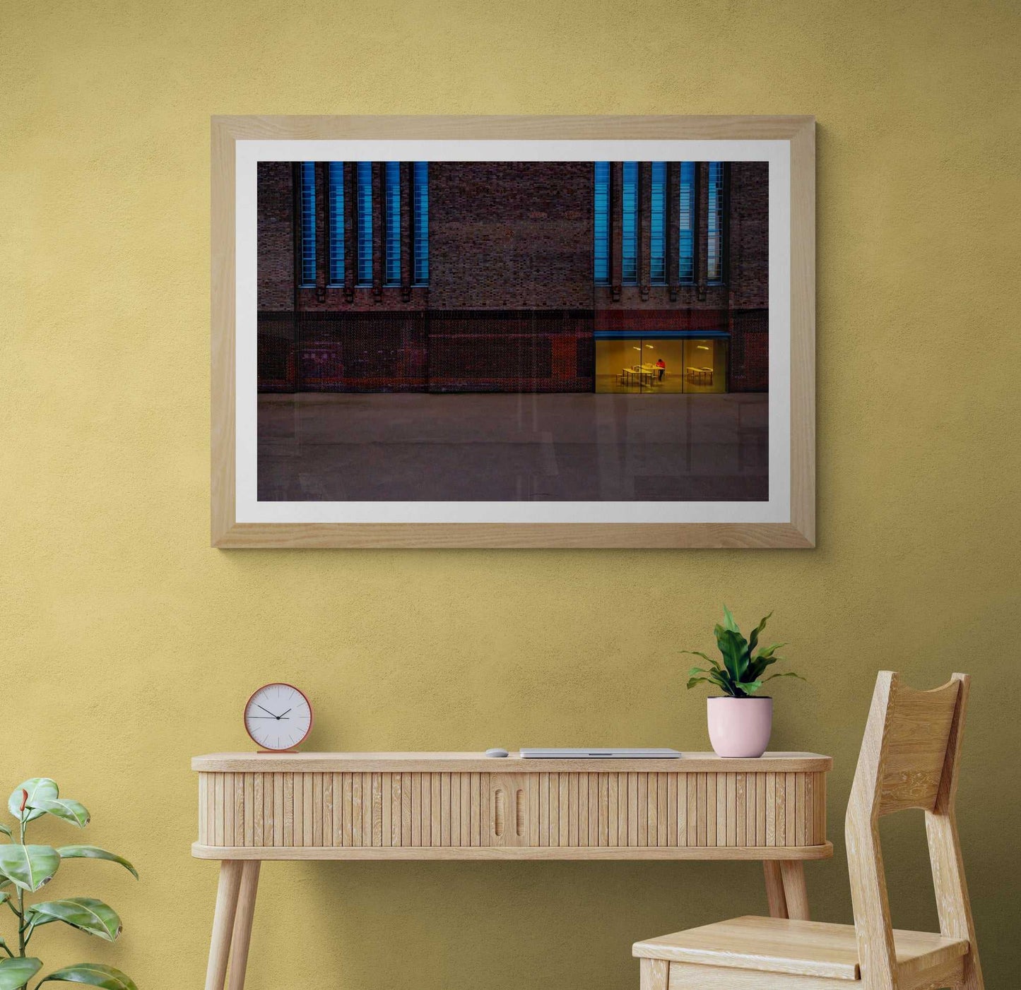 Framed fine art print of The Tate Modern – A Study in Color and Line displayed above a wooden desk, enhancing a cozy home office decor with modern London photography.
