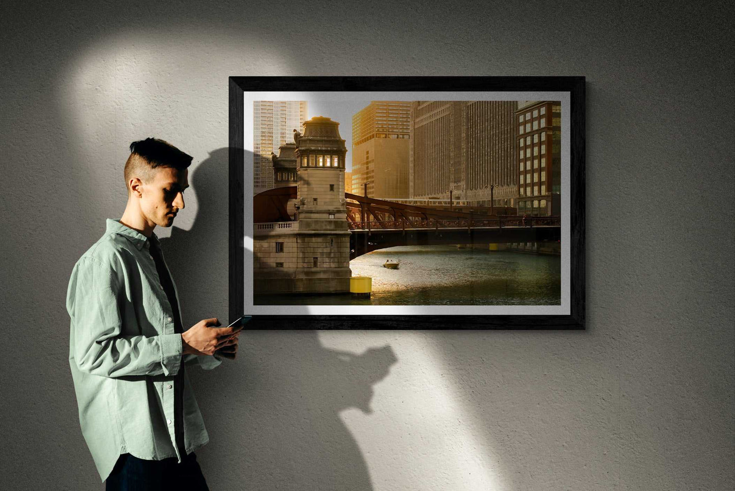 Man viewing Chicago River #1 – Limited Edition Fine Art Photograph by Michael Hart in gallery lighting, highlighting the fine art's golden hour ambiance.