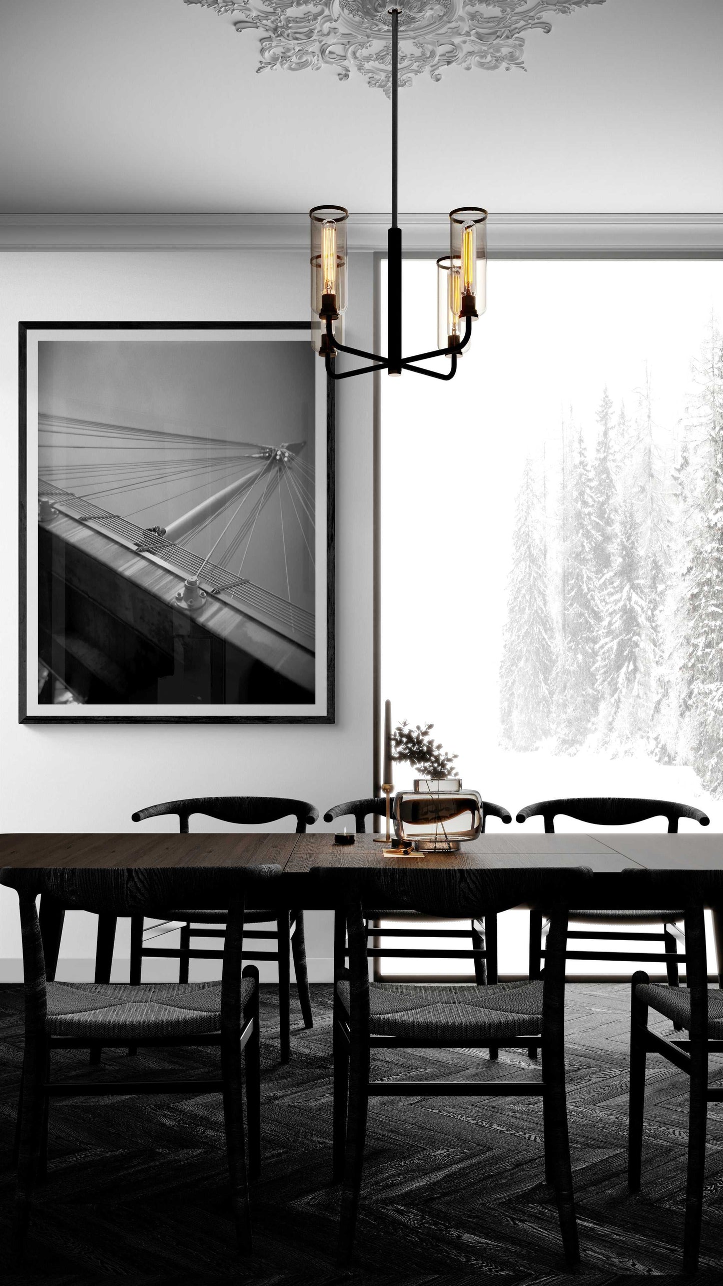 A framed black and white Holga camera image of the Golden Jubilee Bridge in London, England in a dining room setting with a winter snow outside the window