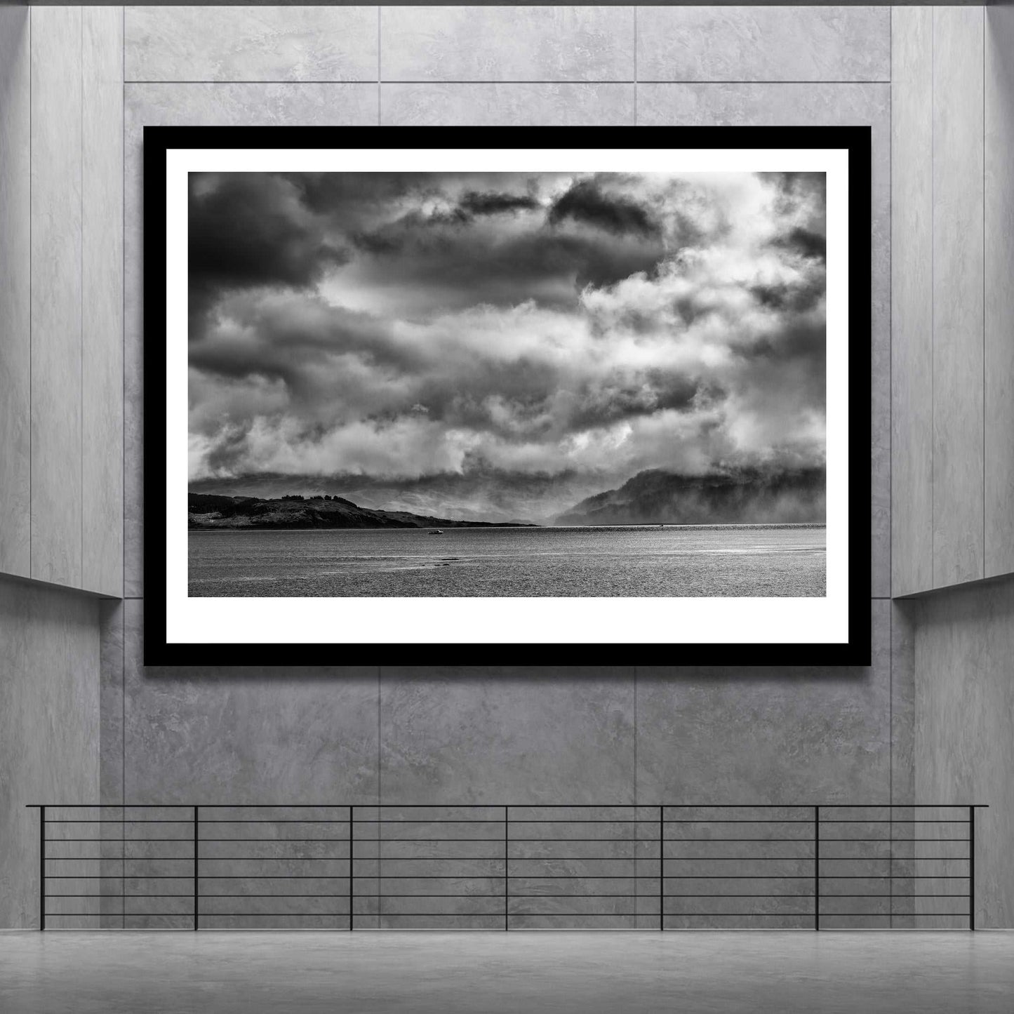 Oversized Isle Of Skye Print by Michael Hart - Storm Clouds Kyleakin in a minimalist grey gallery space. A powerful black and white landscape centerpiece.