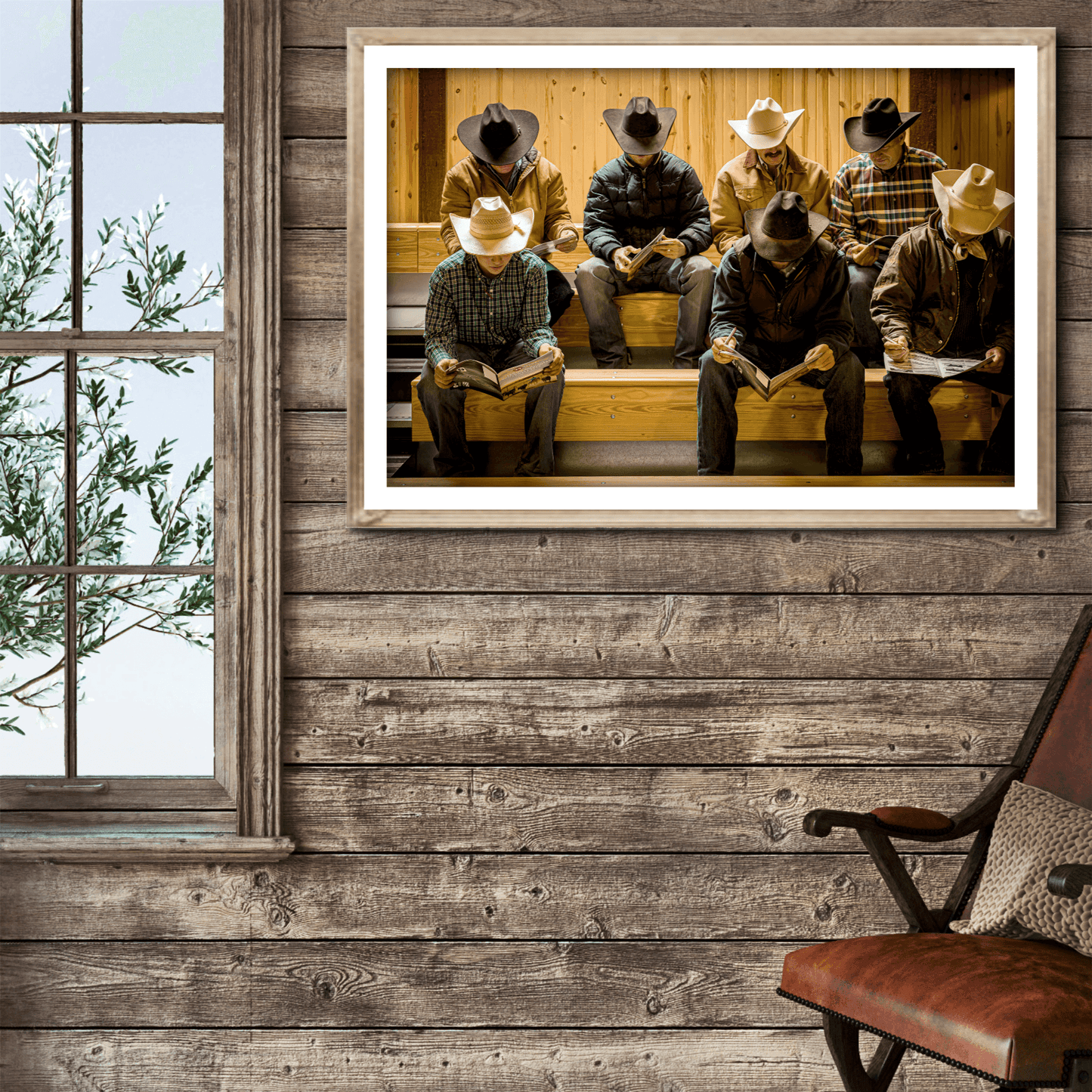 Before the Sale cowboy hat fine art print displayed in a rustic cabin-style room with wood walls and a leather chair, evoking ranch life.