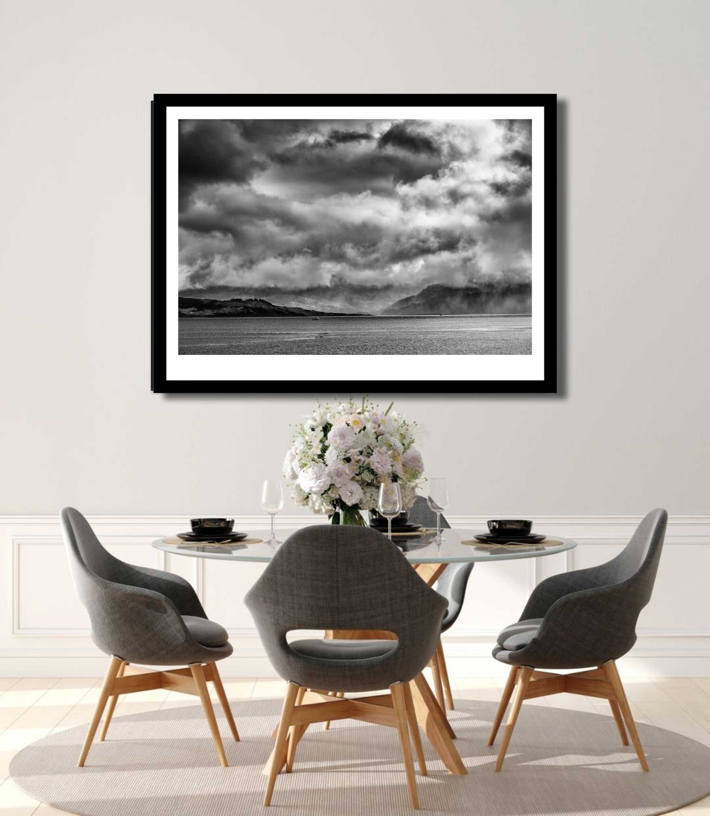 Storm Clouds Kyleakin - Isle Of Skye Print by Michael Hart displayed in a minimalist dining room. The dramatic monochrome print elevates elegant dining decor.