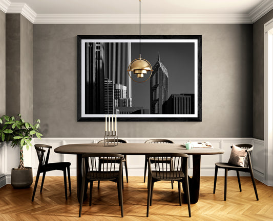 Corporate Gothic black and white Chicago architecture photograph displayed as framed wall art in an elegant contemporary dining room.