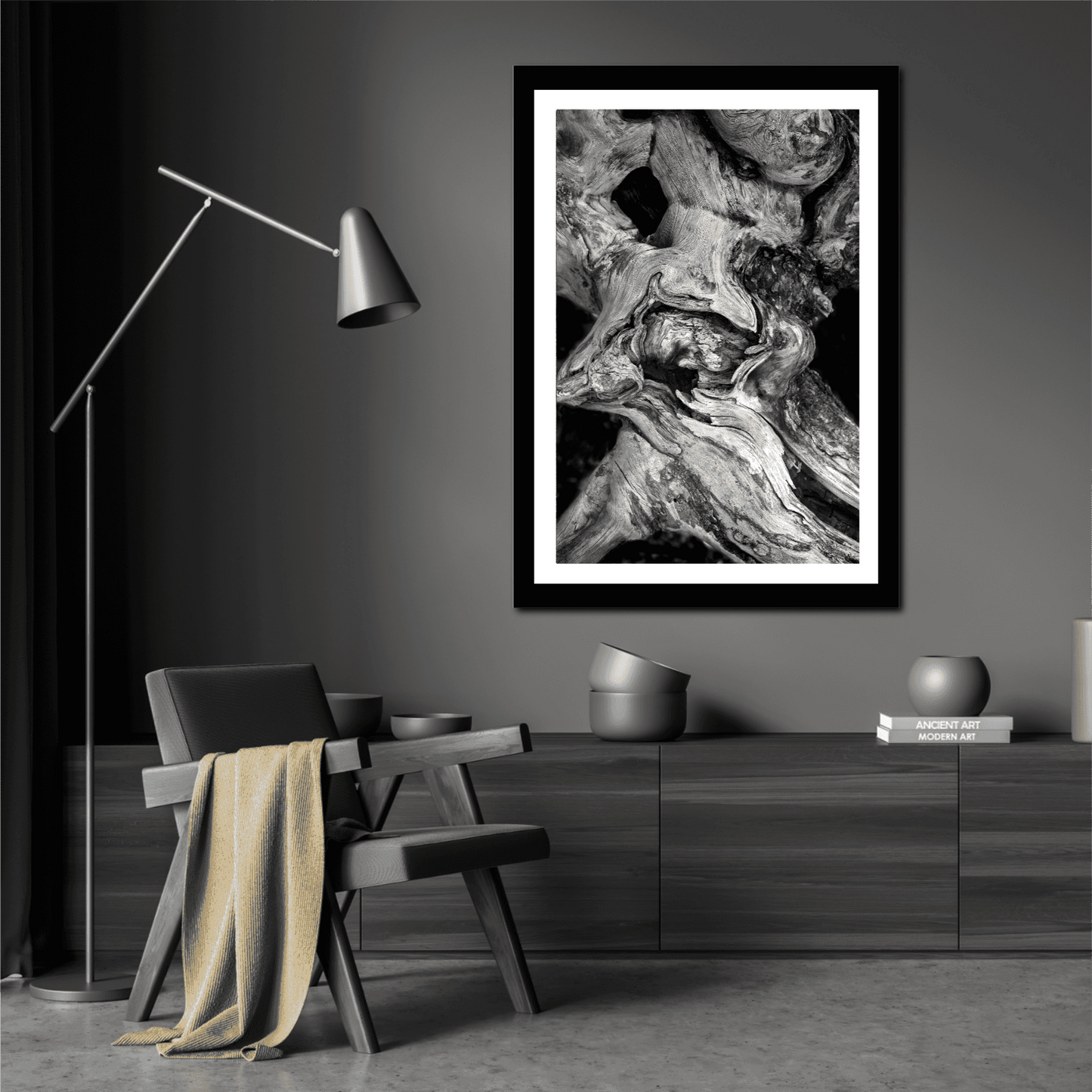 Dead Tree Detail, Yellowstone – Limited Edition Black and White Fine Art Photograph in black frame, styled in a dark modern living space with accent lighting.