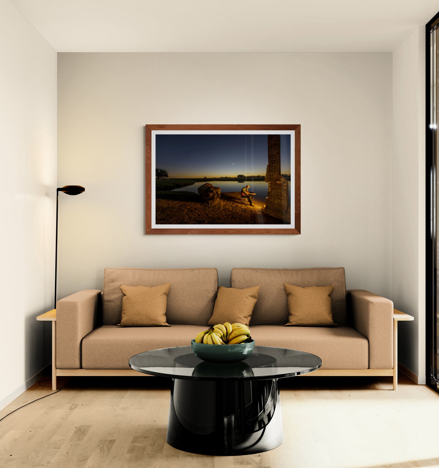 Dream Big, western singer-songwriter image, on living room wallwith a beige sofa, black coffee table, and framed artwork on the wall.