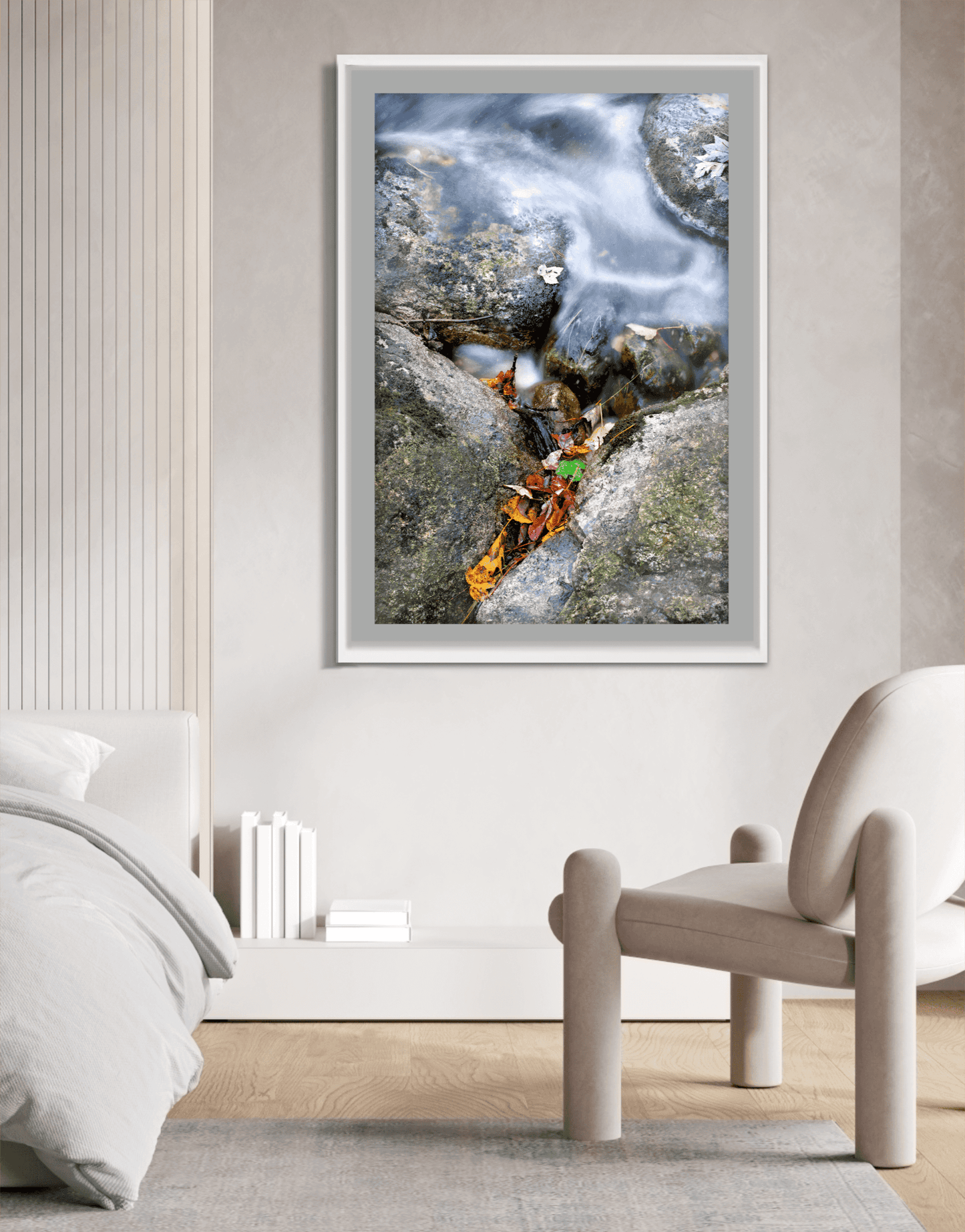 First Frost limited edition fall creek photograph in a white frame, styled in a modern bedroom with soft neutral tones and minimalist decor.