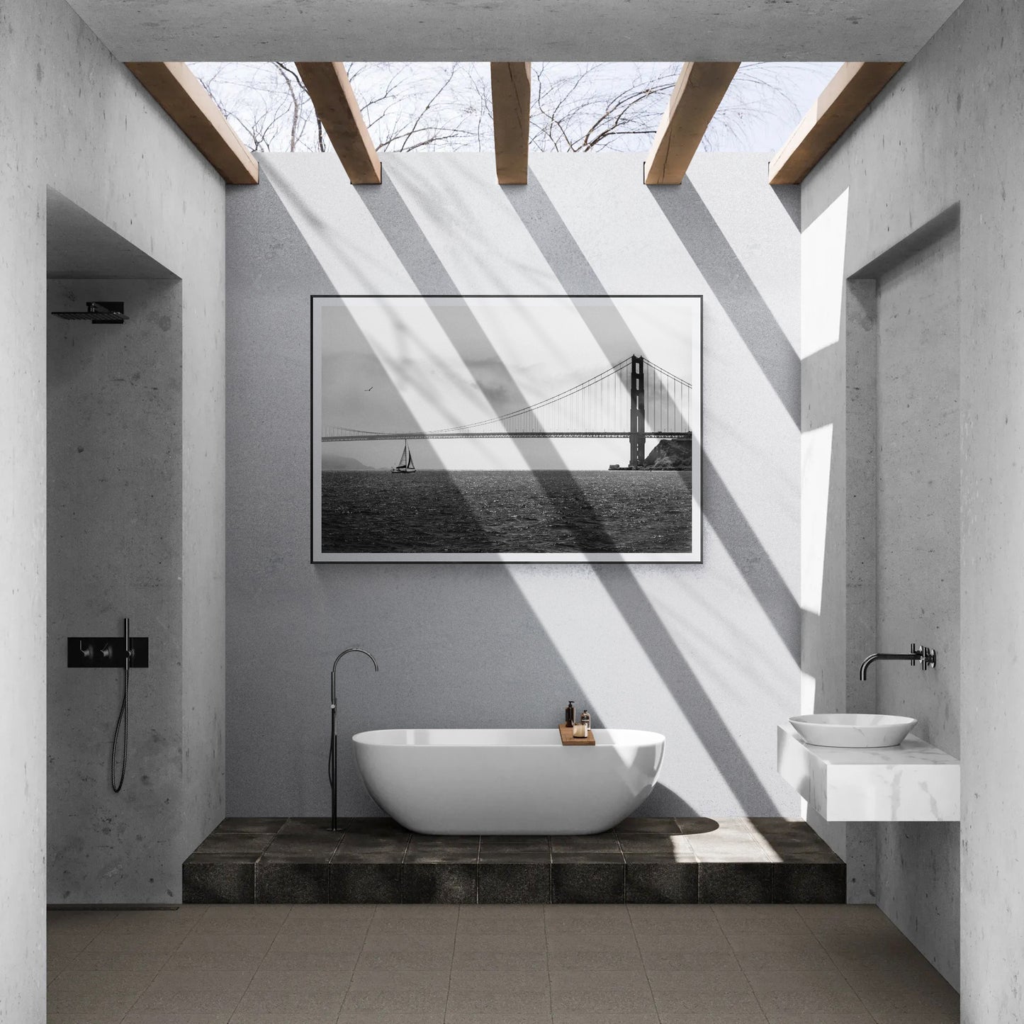 Framed black and white print of sailboat in front of The Golden Gate Bridge in a luxury house outdoor bathroom
