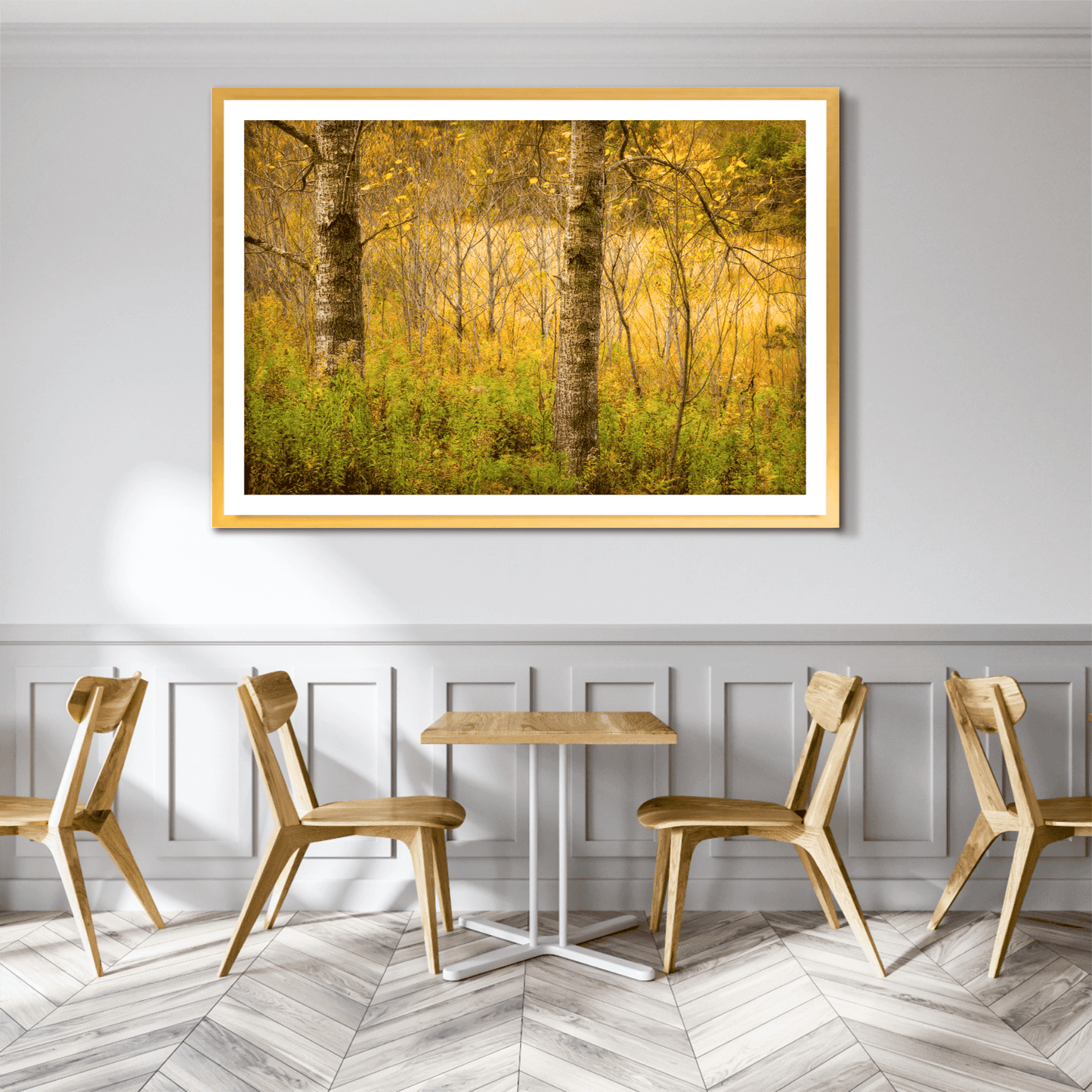 Golden Woods fine art photo displayed in a cozy café setting, adding seasonal charm with golden foliage and layered forest textures from Maine.