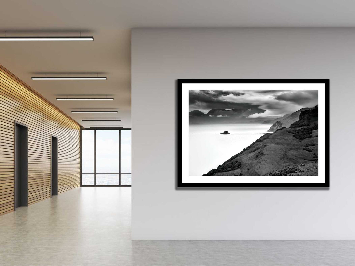 Framed Holm Island – Black & White Fine Art Print in a minimalist hallway, showcasing textured clouds and sea from the Isle of Skye.