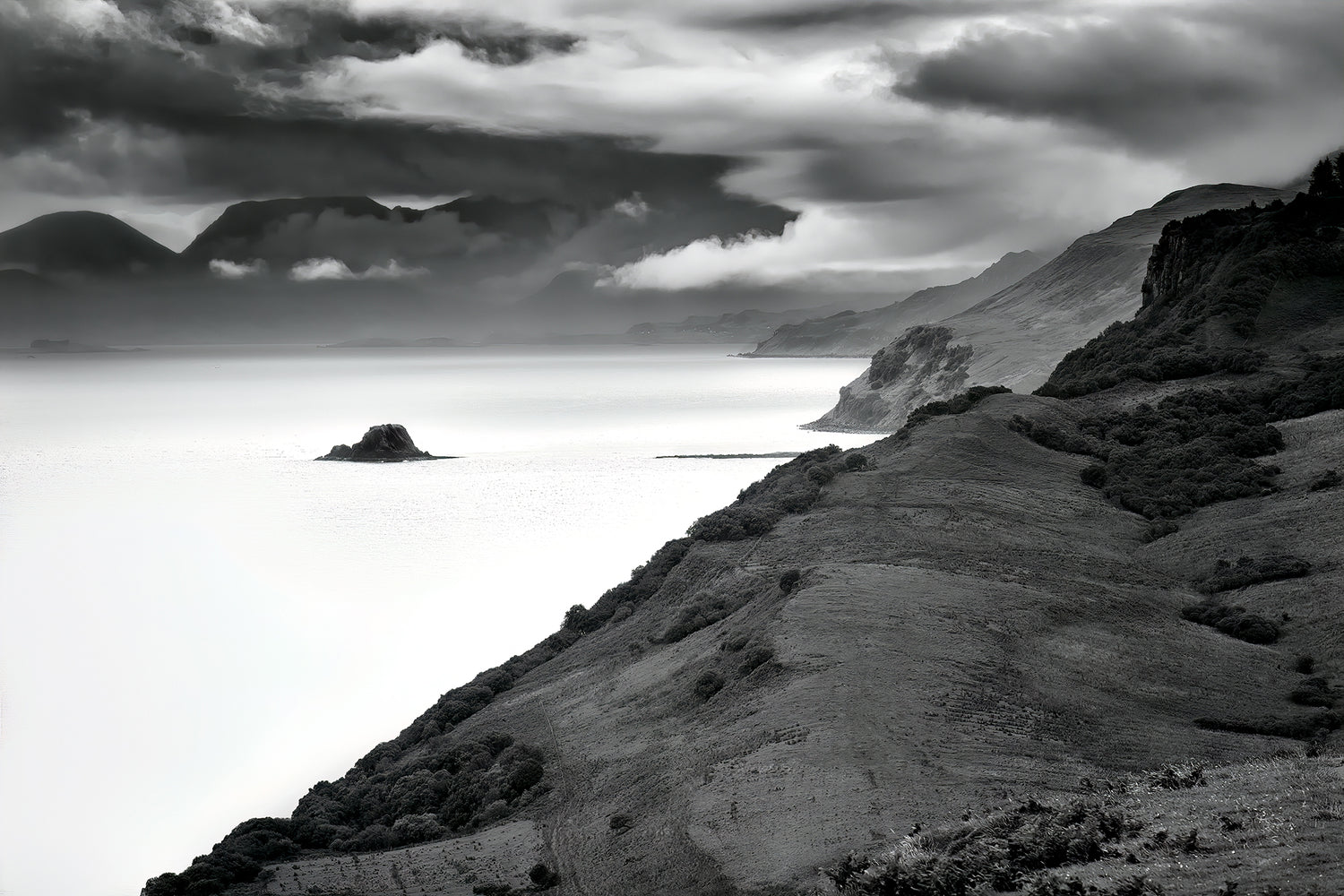 Black and white landscape photo of Holm Island and The Isle of Skye, Scotland