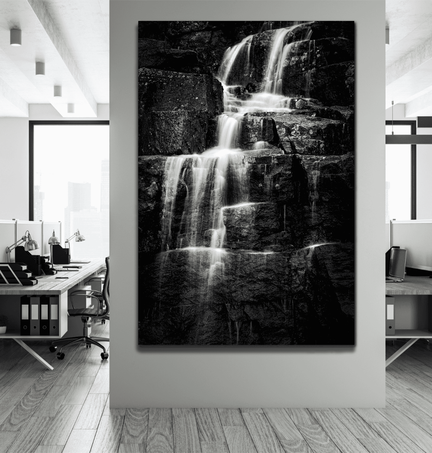 Large black and white waterfall print titled Woodland Cascade by Michael Hart displayed in a modern office, ideal for interior design and art collectors.