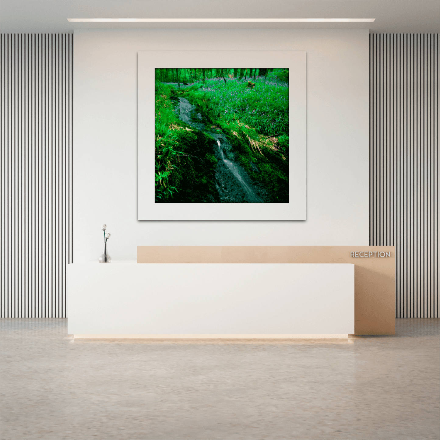 Square format Lomond Creek Scotland photography print in a minimalist office reception, highlighting a serene creek and wildflowers near Loch Lomond.