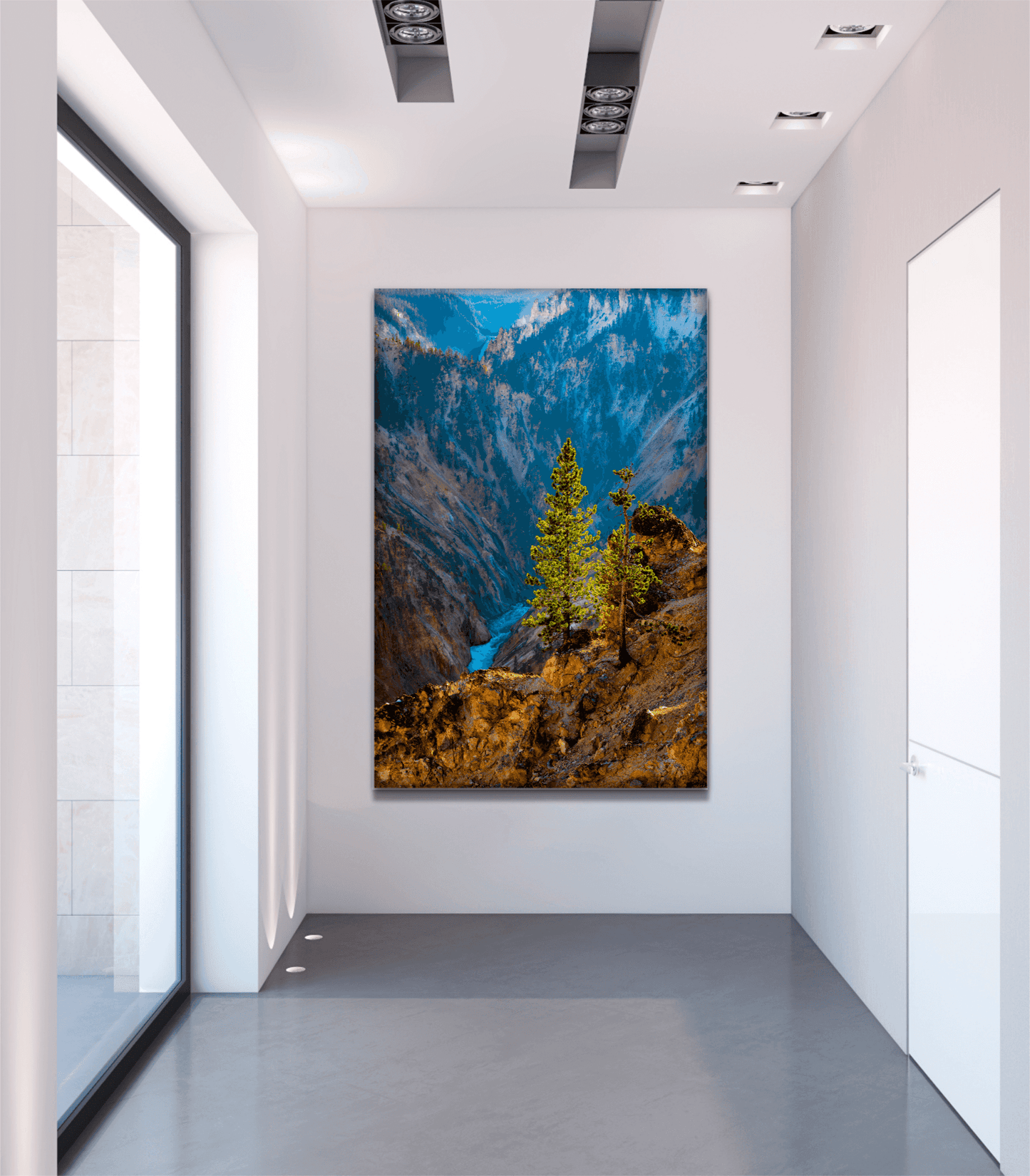 Large fine art Yellowstone photography print of a sunlit tree over canyon river showcased in a minimalist gallery hallway. Perfect for collectors.
