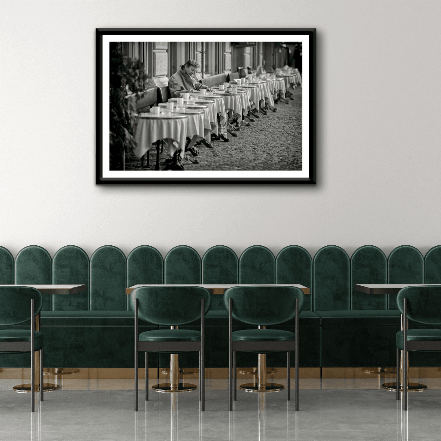 Zurich Series #3 – The Man at the Café, Zurich in Black and White – Fine Art Print by Michael Hart framed in a chic dining space. Elegant monochrome street photography ideal for upscale interior design.