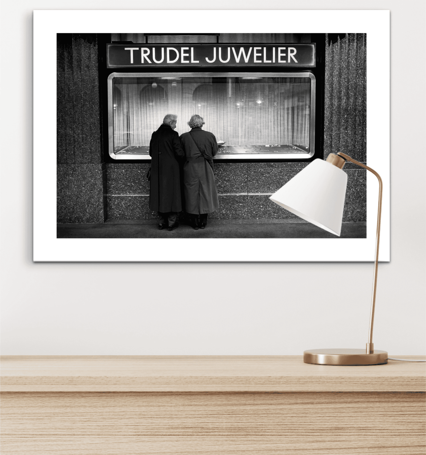 Zurich Series #7 – Window Shopping on Bahnhofstrasse fine art print with white matting placed above a wooden credenza with a modern lamp.