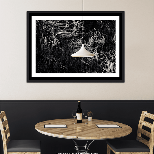 Framed Reeds in Water – Grand Teton Fine Art Black & White Landscape by Michael Hart displayed above a dining table. Elegant wall art for modern interiors.