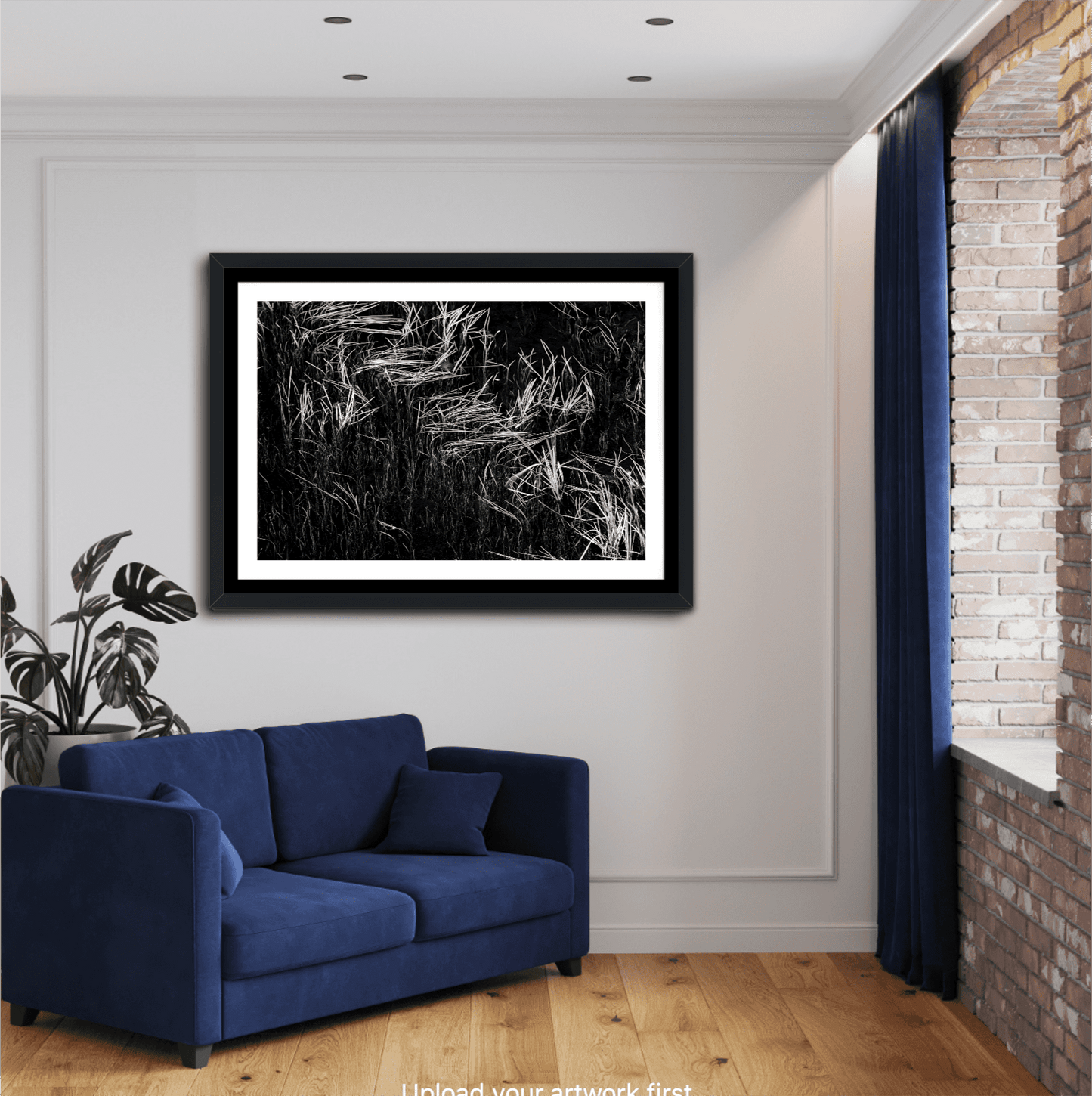 Framed Reeds in Water – Grand Teton Fine Art Black & White Landscape by Michael Hart above a blue couch. Monochrome artwork for stylish interiors.