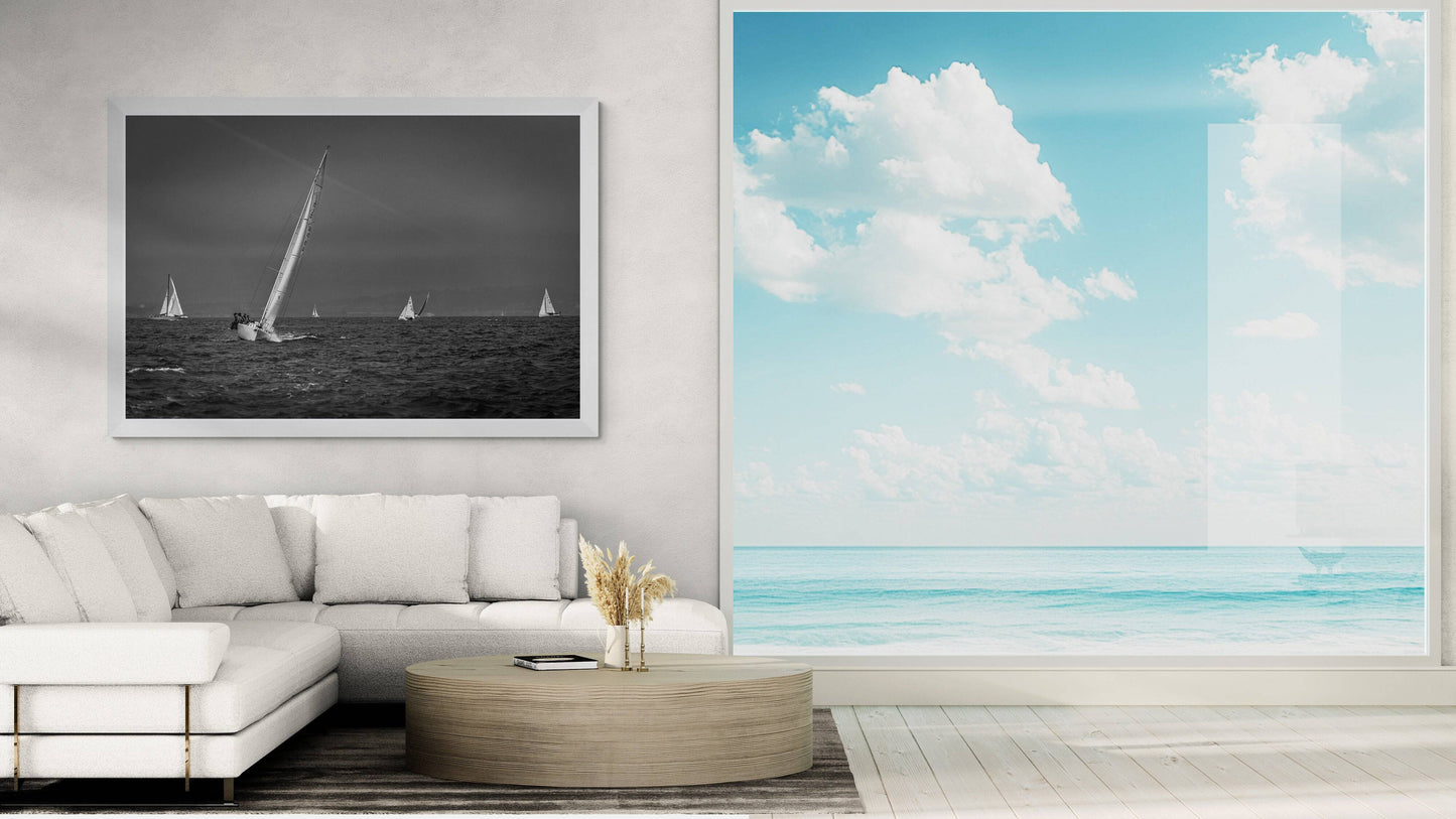 Framed black and white sailing photograph of a starboard tack on San Francisco Bay on the wall of a beach house.