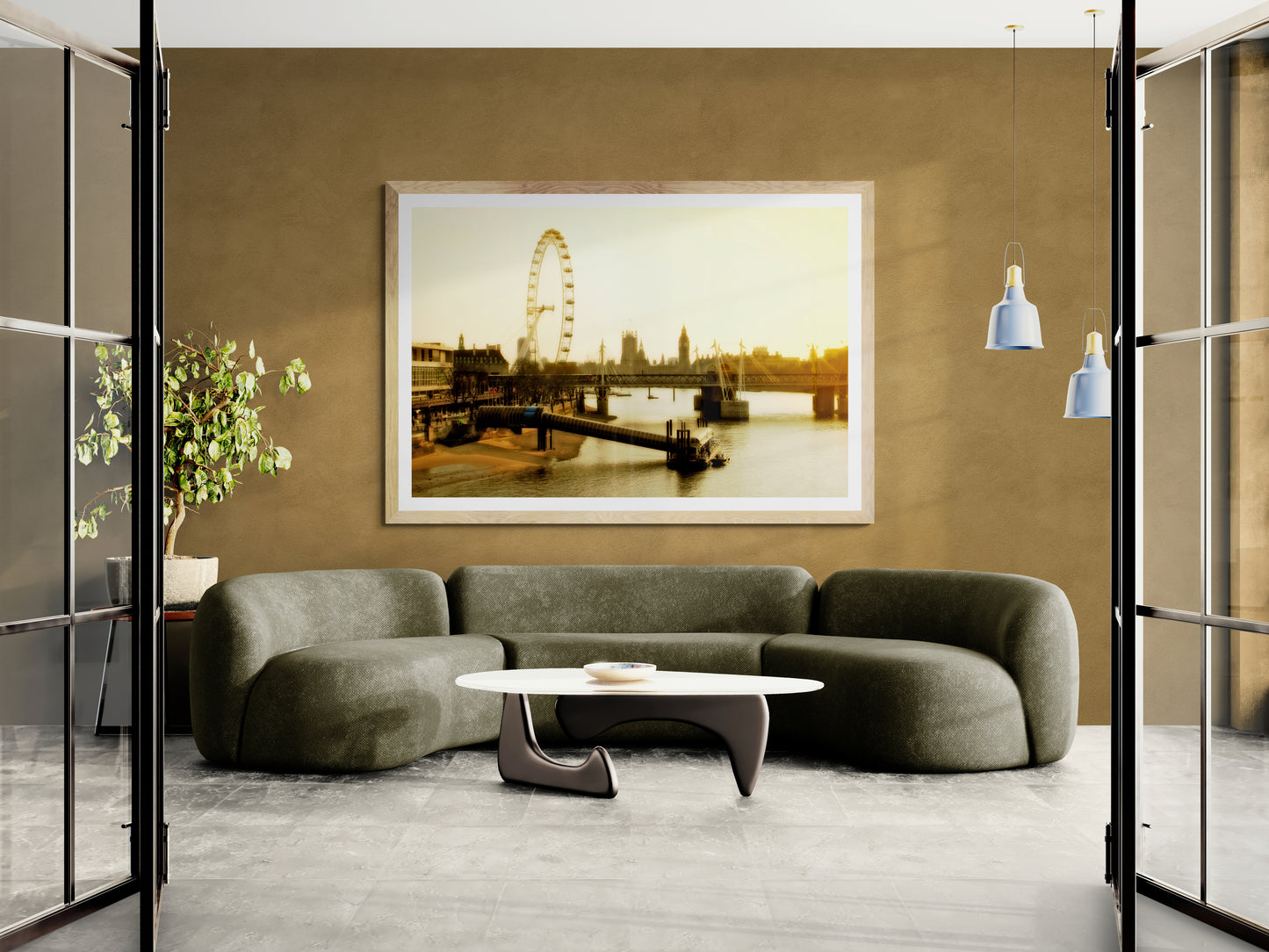Modern living room with a gray sofa, round coffee table, and framed picture of the London Eye in Golden Light