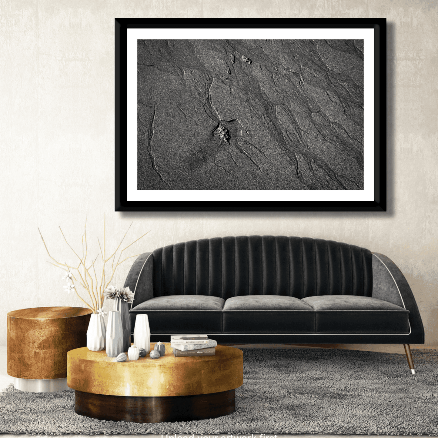 Traces #2 black and white sand photography displayed above a black velvet sofa. Elegant fine art print adds texture to luxury living room.