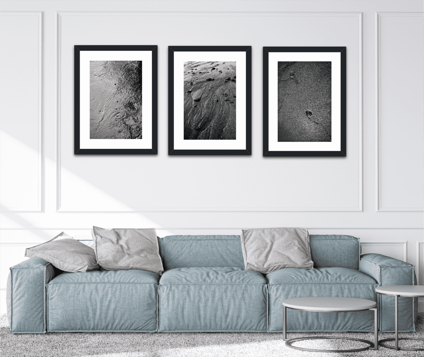 Triptych wall display featuring 'Traces #3' black and white sand photography in a modern living room, perfect for fine art collectors and designers.