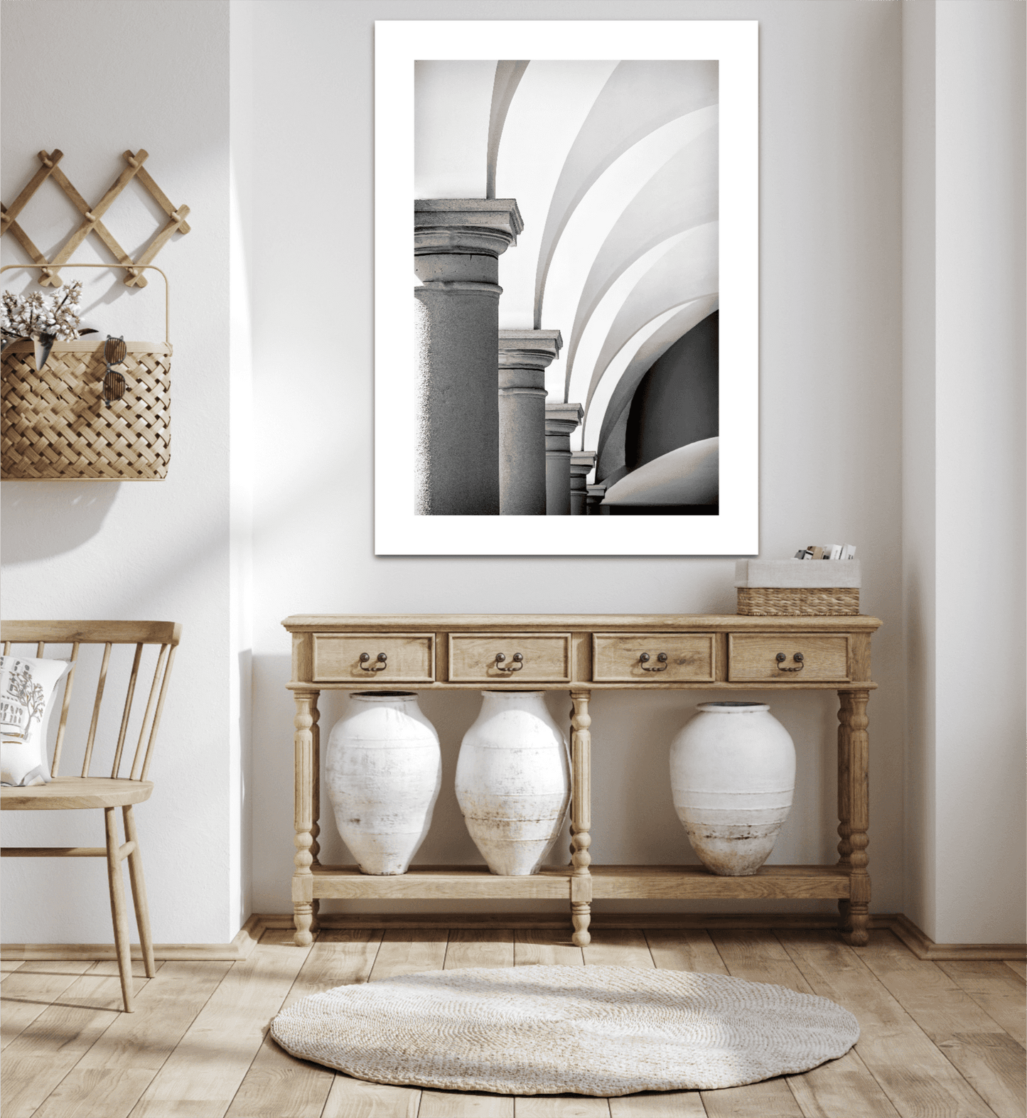Arches, Barberino – Limited edition black and white photograph of Italian architecture displayed in a modern rustic interior with neutral decor. Fine art print featuring Tuscan arches and soft geometric lines, ideal for wall decor in home and garden spaces.