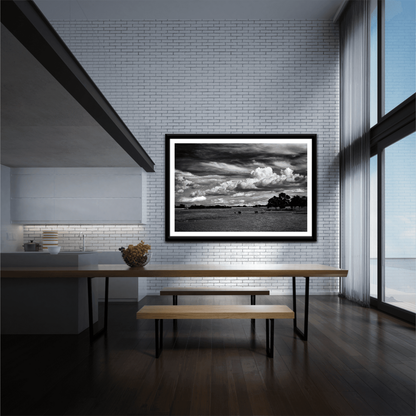 Black and white cowboy herding cattle print 'Under a Texas Sky' displayed in a modern dining area with tall windows and minimalist decor.
